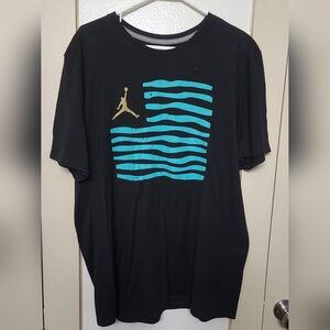 Jordan Black Tee with Teal Waves and Gold Logo